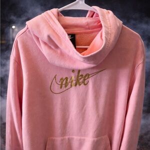 Nike light pink hoodie with gold logo